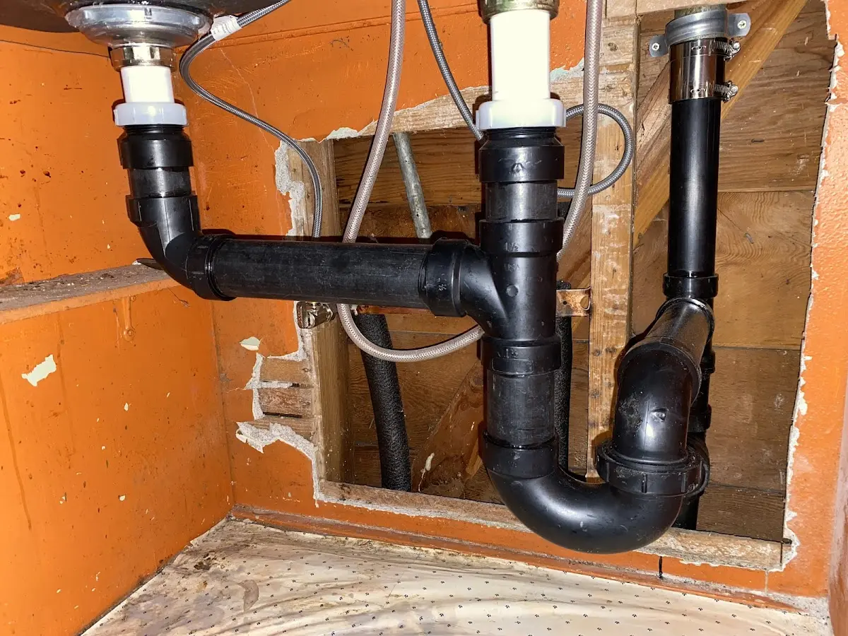 Professional Garbage Disposal Repair equipment and tools on the job in Girard